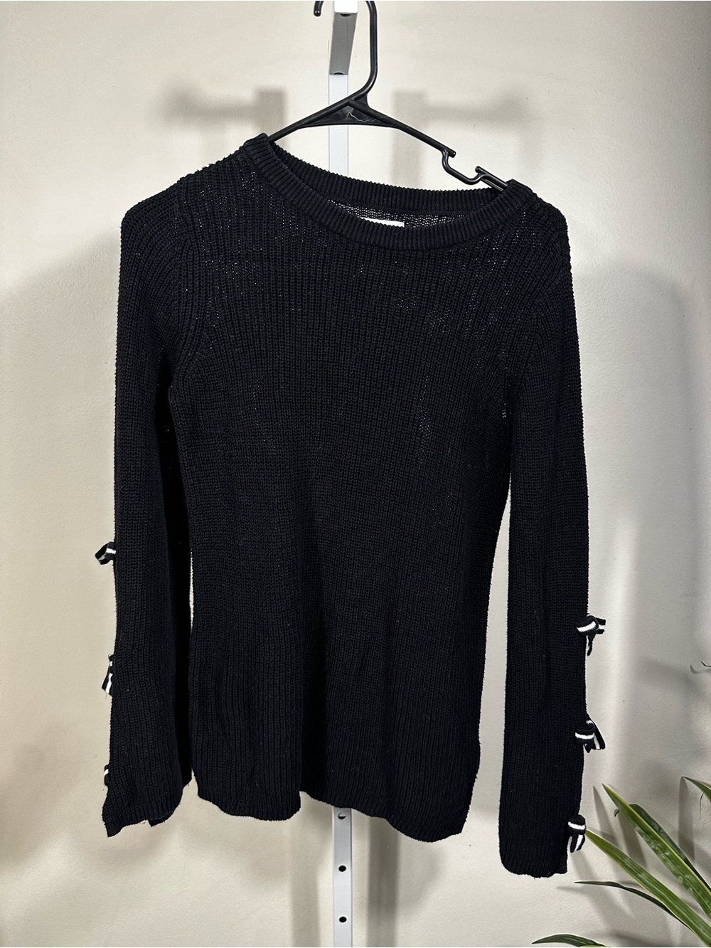 N65. Elle Black Crewneck Sweater with Sleeve Bow Accents